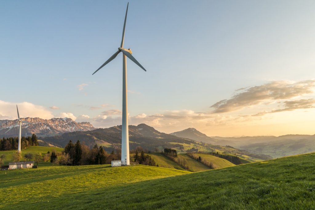 Wind turbine in a field with mountains