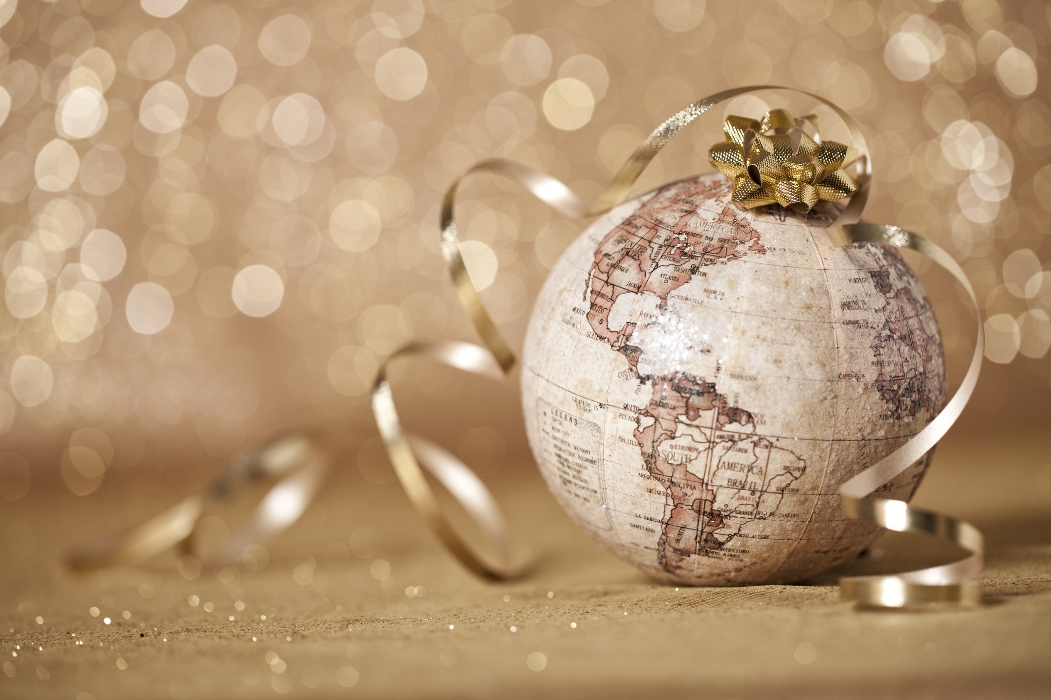 Globe Christmas bauble with gold ribbon