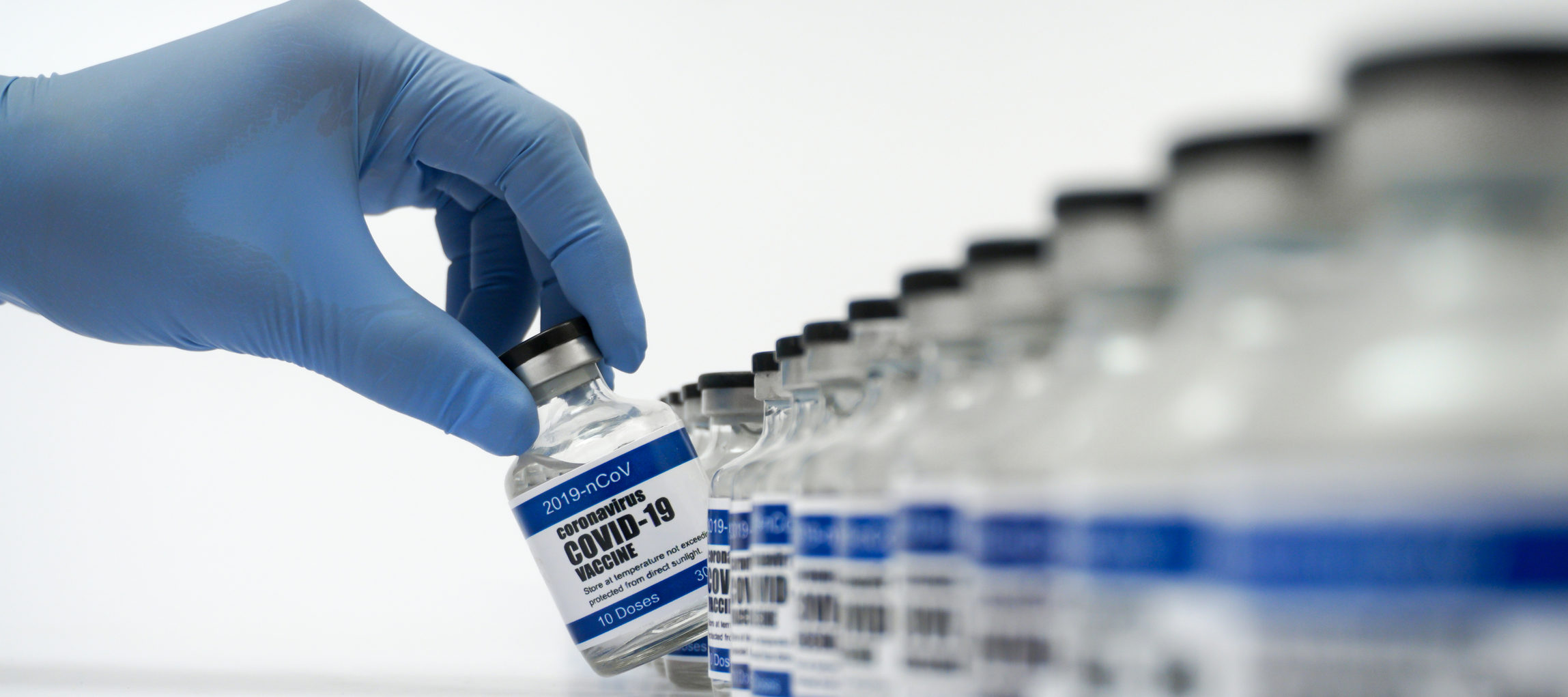 Vaccine vials with "coronavirus COVID-19 Vaccine" text on label