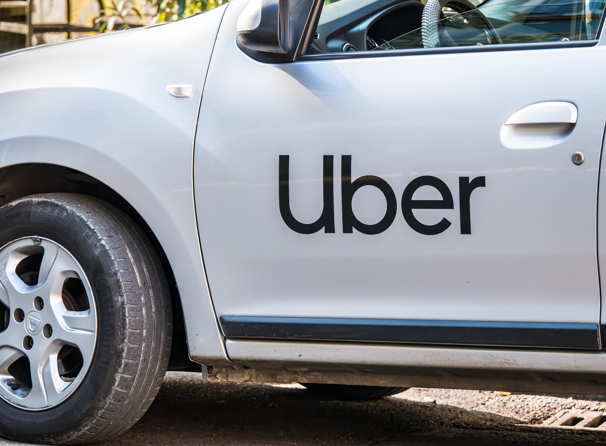 Uber logo on white car